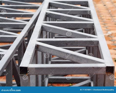 the metal frame of a rectangular box|The metal frame of a rectangular box has a square base. The .